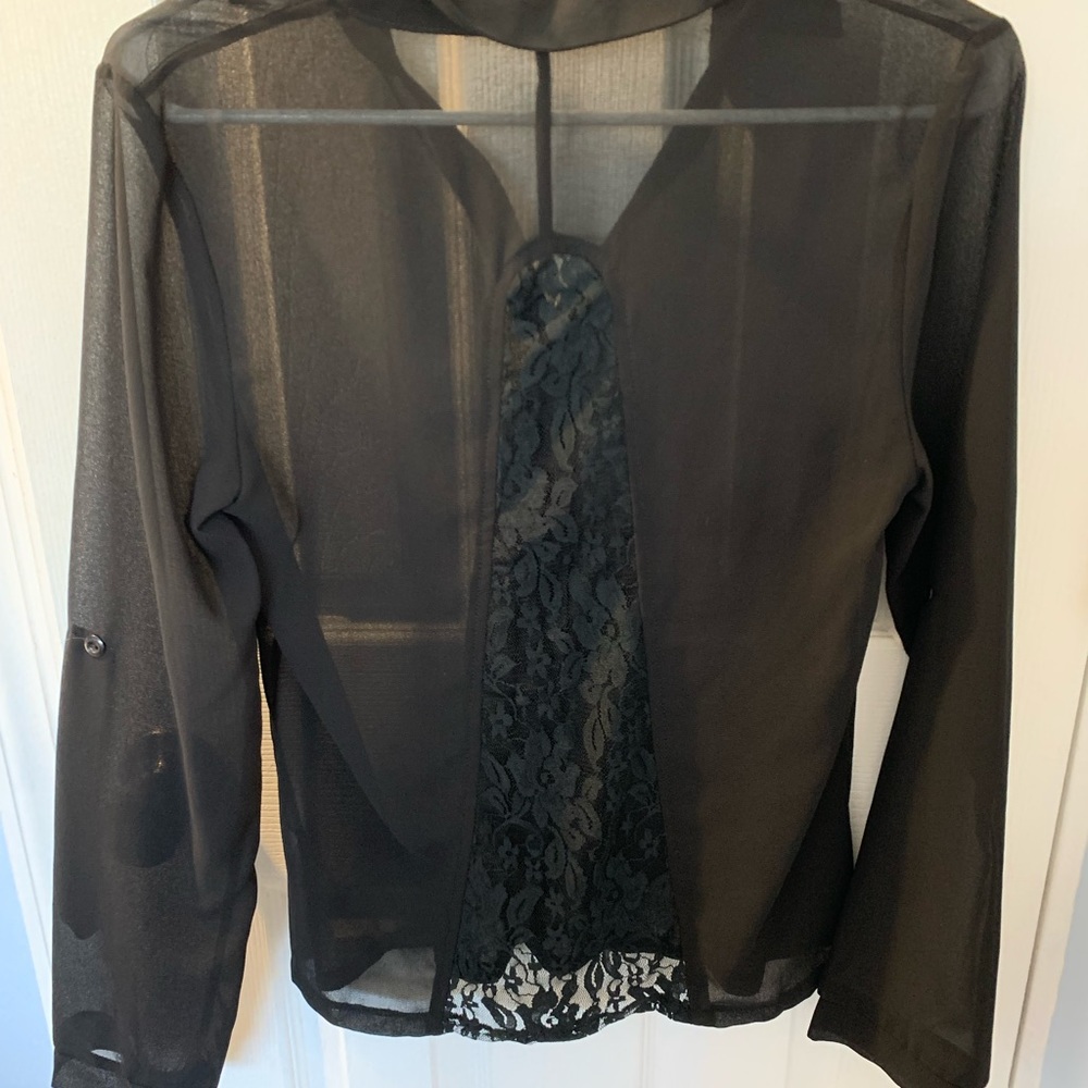 Black sheer noise with black lace on the back.